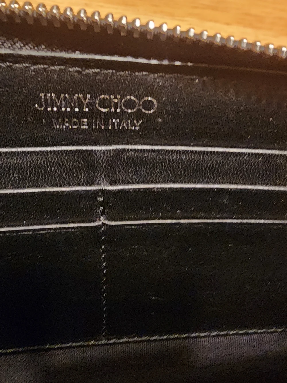 Jimmy Choo Filipa Star Studded Wallet, a black leather zip-around wallet